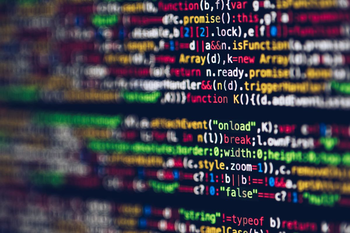 Extreme close-up of colorful code on a screen