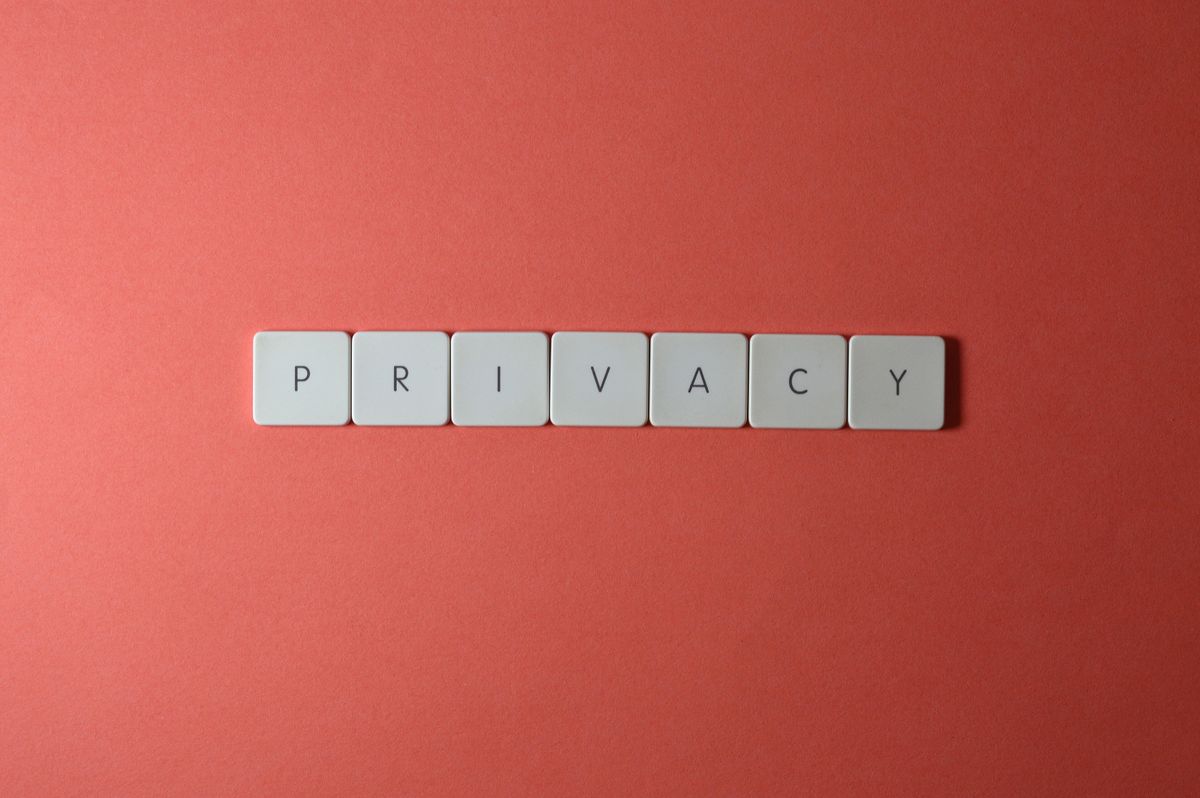 Keyboard keys spelling out the word privacy on a red background