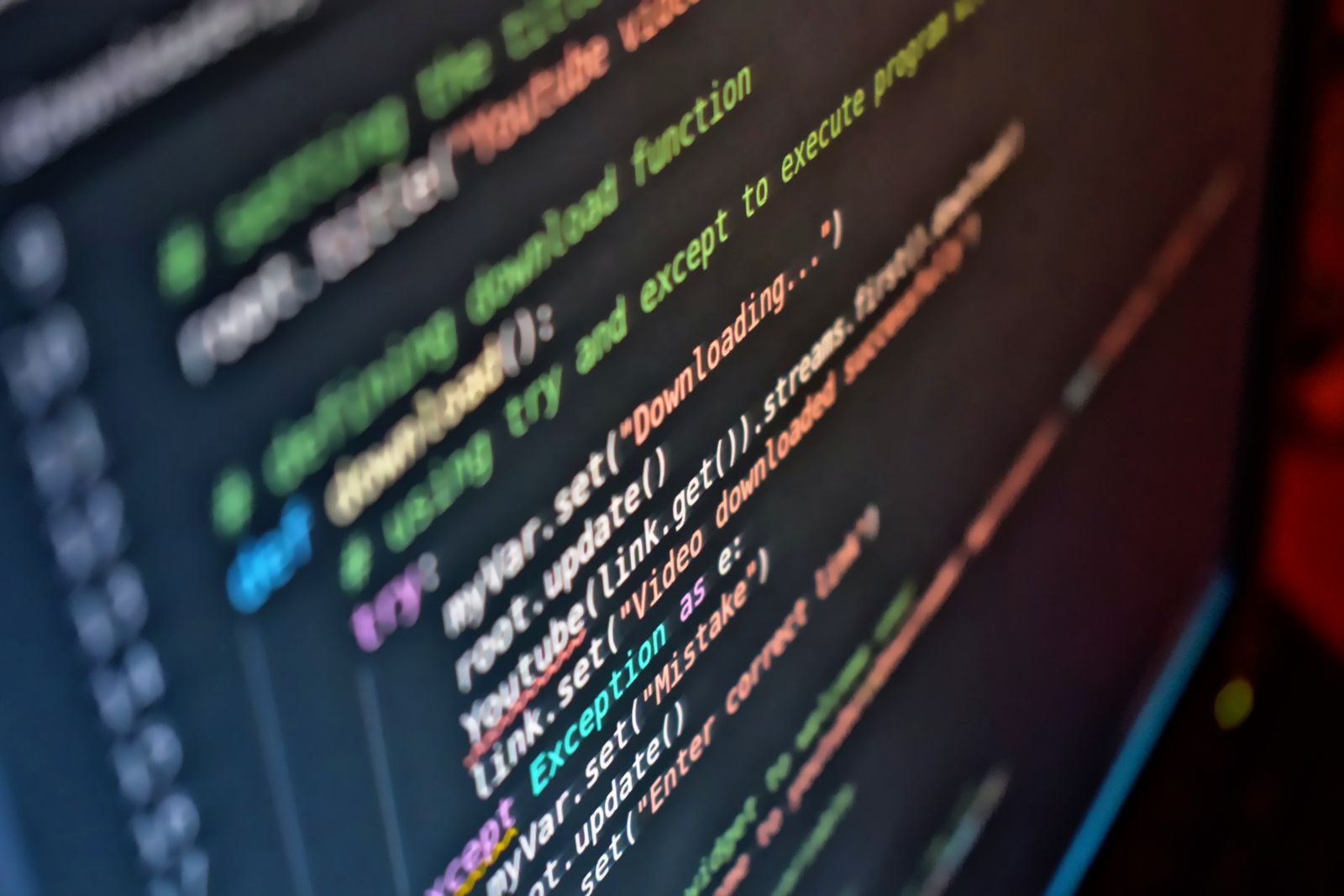 Green and red Python code on a dark terminal screen